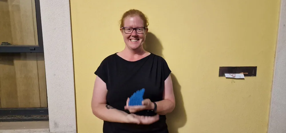 woman posing with award