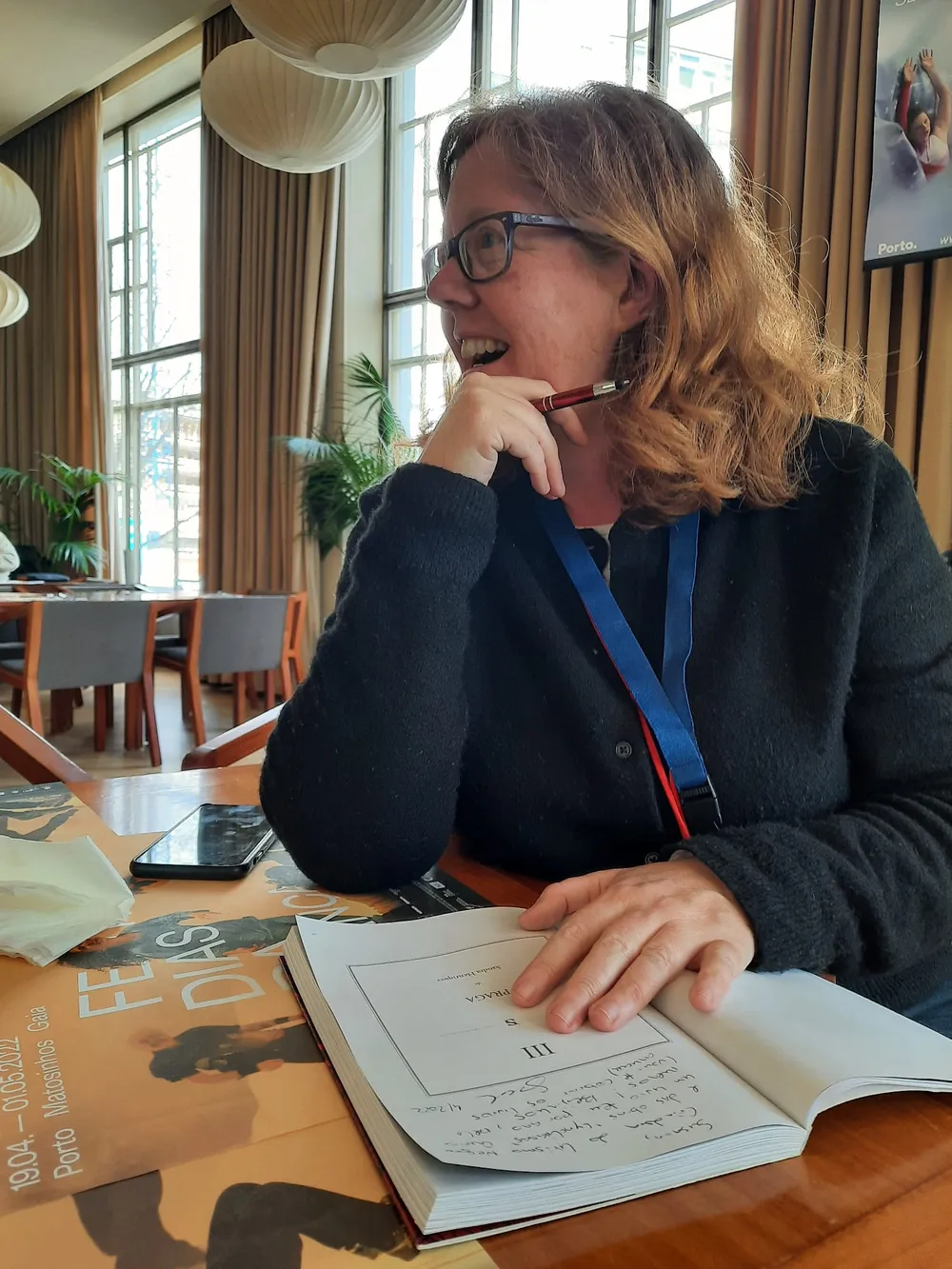 woman signing autographs